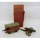 Hornby carriage in box and a model cannon (2)