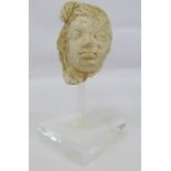 Possibly clay head after a Roman original of female form Condition ReportThe head is 13cm high x 9cm