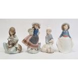 Lladro group of girl washing a dog, another model of rabbit, another cow, seated and swan with