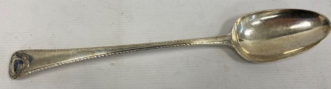 An 18th century silver serving spoon, monogramed handle, London makers mark TE over GS, 3toz.