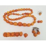 Graduated butterscotch amber beaded necklace, 60.9g approx, largest bead 2.5cm x 2cm approx,