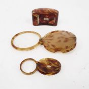 Two tortoiseshell eye glasses and a small Georgian tortoiseshell snuffbox with silver inlay, with