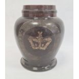 Old treacle glazed storage pot, squat baluster shaped with indistinct wording and crown, 23cm high