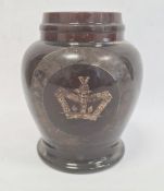 Old treacle glazed storage pot, squat baluster shaped with indistinct wording and crown, 23cm high