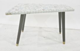 Mid 20th century tile pebble top shaped coffee table on four ebonised supports, to brass caps,