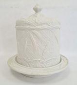 19th century salt glazed stoneware Stilton dish and cover, the cylindrical cover embossed with