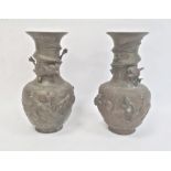 Pair Chinese bronze vases, baluster-shaped and each embossed with pair dragons and flaming pearl and