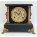 Mantel clock with arabic numerals, painted black body and gold painted highlights, chiming