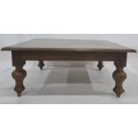 20th century mahogany coffee table, the square top with moulded edge, on turned supports to peg feet