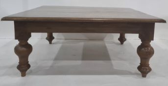 20th century mahogany coffee table, the square top with moulded edge, on turned supports to peg feet