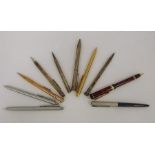 Assorted white metal propelling pencils and pens, etc