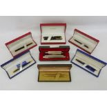 Assorted fountain pens including Sheaffer and Waterman and a Hohner Super Chromonica chromatic