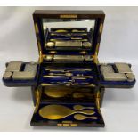 A Victorian coromandel and brass bound dressing case, by George Betjemann and Sons, Bedford 67