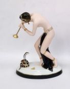 Royal Dux tinted bisque and glazed porcelain figure of a semi-nude snake charmer, on oval base, 23.