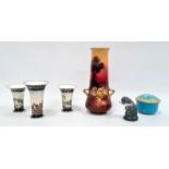 Garniture of three English porcelain blue ground spill vases, circa 1820 painted with a continuous