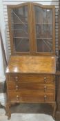 Mid 20th century figured walnutwood bureau bookcase with pair lead light doors above and on cabriole
