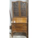 Mid 20th century figured walnutwood bureau bookcase with pair lead light doors above and on cabriole