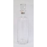 Baccarat glass decanter with silver mounts by Theo Fennell, London 1989, of bottle form with