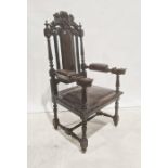 Victorian armchair, the carved top rail in form of lion bearing shield, leather upholstered back,