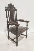 Victorian armchair, the carved top rail in form of lion bearing shield, leather upholstered back,