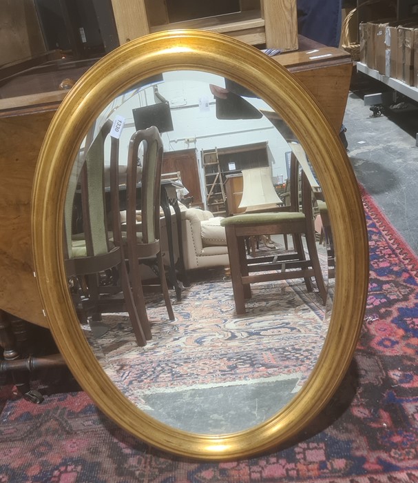 Modern oval mirror in gilt-effect moulded frame, 81cm x 60cm