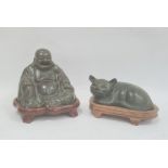 Bronze effect seated buddha on stand and similar lying cat, green patinated finish