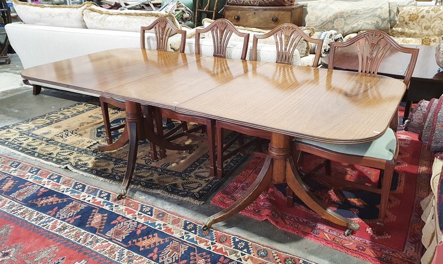 Regency style mahogany dining table with reeded edges, pedestal support, extended 211cm x 96cm wide