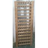 20th century pine bottle rack with 14 shelves, each shelf holds six bottles, 68cm x 174cm