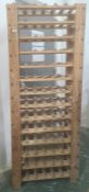 20th century pine bottle rack with 14 shelves, each shelf holds six bottles, 68cm x 174cm