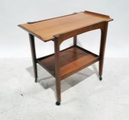 Mid-century designer two-tier teak tea trolley, on castors, 78.5cm wide