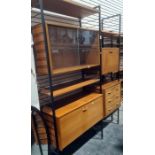 Ladderax lounge unit consisting three uprights, sliding glass unit, three drawer unit, secretaire