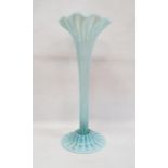 Large Victorian vaseline glass trumpet vase, having wavy everted rim, reeded column, on circular