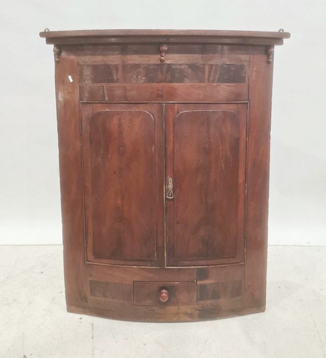 19th century wall hanging corner cupboard, two doors over one drawer