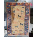 Modern Eastern-style rug, yellow ground decorated with animals, in peach and blue border, 144cm x