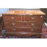 20th century mahogany blanket chest in from of a low chest of drawers