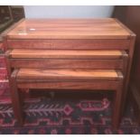 Mid-century nest of three probably Santos Palisander wood coffee tables