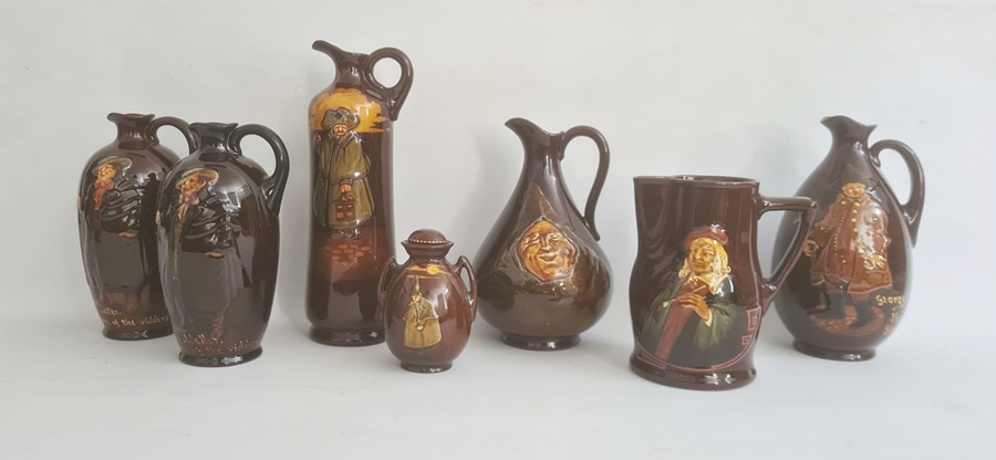 A collection of seven Royal Doulton wares comprising a Kingsware "Watchman" tall jug, 27cm high, a