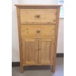 20th century pine unit with two drawers above two cupboard doors, on square section supports, 65cm x