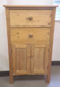 20th century pine unit with two drawers above two cupboard doors, on square section supports, 65cm x