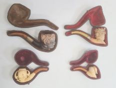Four meerschaum pipes including Bacchanalian male head, medium sized lady and bonnet, small spaniel,