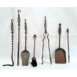 Set of four iron fireside implements with open spiral twist and hook handles, a similar shovel and