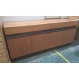 Possibly 1980's G-Plan teak sideboard, the rectangular top above two drawers and four cupboard