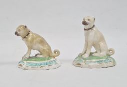 Two various early 19th century Staffordshire china miniature seated pug dogs, the largest 6.5cm high