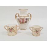 Royal Worcester ivory ground two-handled small vase painted with a bouquet of flowers within gilt