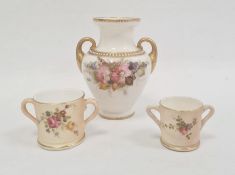Royal Worcester ivory ground two-handled small vase painted with a bouquet of flowers within gilt