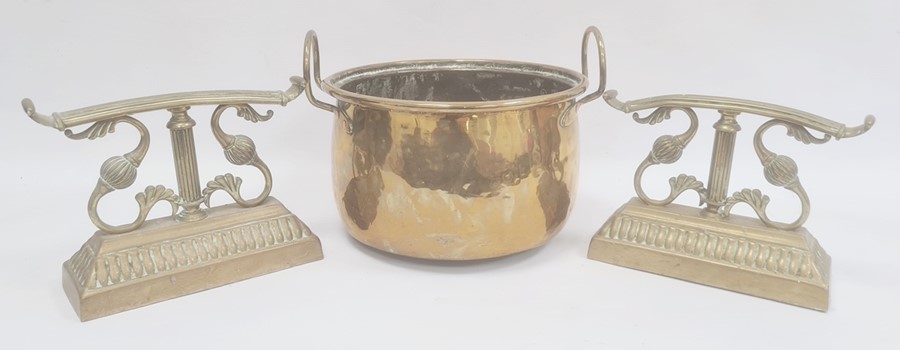 Brass firedogs, foliate scroll and reeded bar design on gadrooned plinth and brass two-handled