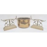 Brass firedogs, foliate scroll and reeded bar design on gadrooned plinth and brass two-handled