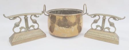 Brass firedogs, foliate scroll and reeded bar design on gadrooned plinth and brass two-handled