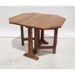 Oak Cotswold School-style gateleg coffee table with octagonal cross-cut oak top (when extended) on