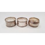 Silver napkin ring and a pair of silver plated napkin rings